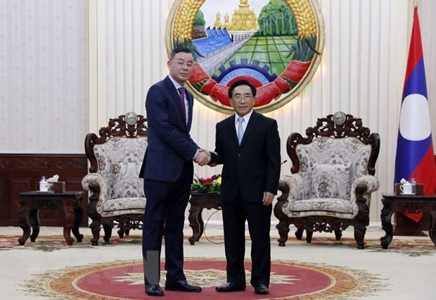 El primer ministro de Laos, Phankham Viphavanh, recibe al auditor general estatal de Vietnam, Ngo Van Tuan. (Foto: VNA) El primer ministro de Laos, Phankham Viphavanh, recibe al auditor general estatal de Vietnam, Ngo Van Tuan. (Foto: VNA)