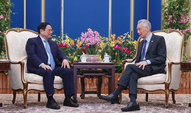 El primer ministro vietnamita, Pham Minh Chinh, y su homólogo singapurense, Lee Hsien Loong, en la conversación (Fotografía: VNA) El primer ministro vietnamita, Pham Minh Chinh, y su homólogo singapurense, Lee Hsien Loong, en la conversación (Fotografía: VNA)