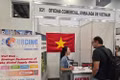 Empresas internacionales visitan el stand vietnamita. (Foto: VNA)