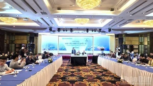 Escena del seminario. (Foto: Nhan Dan)