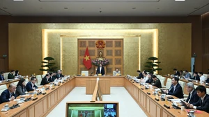 Escena de la reunión. (Foto: Nhan Dan)