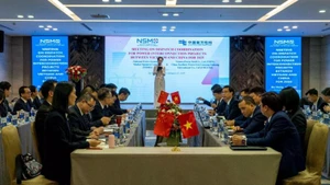 Vista de la Conferencia sobre la coordinación de la operación de la red eléctrica interconectada Vietnam-China.