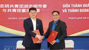 Firma del memorando de entendimiento entre las organizaciones juveniles de Ciudad Ho Chi Minh y de Chongqing (China) (Foto: VNA)