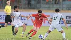 Una de las jugadas en el partido. (Foto: VNA)