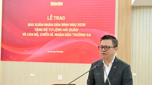 Le Quoc Minh, presidente editor del diario Nhan Dan habla en la cita (Foto: Nhan Dan)