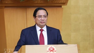 El primer ministro, Pham Minh Chinh, habla en la cita (Foto: VNA)