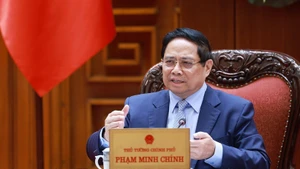 El primer ministro de Vietnam, Pham Minh Chinh, interviene en la reunión. (Foto: VNA)