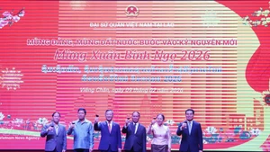 Delegados en el evento saludan el Año Nuevo Lunar (Foto: VNA)