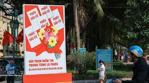 Un cartel para celebrar el día de las elecciones (Foto: VNA)