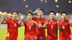 Jugadores vietnamitas celebran la victoria contra Corea del Sur. (Foto: VNA)