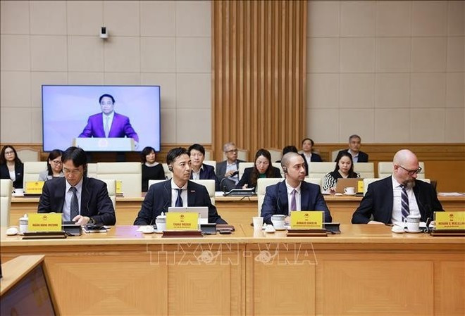 Delegados que asisten a la Conferencia de consulta con expertos y organizaciones nacionales e internacionales sobre el establecimiento de un Centro Financiero Internacional en Vietnam. (Foto: VNA) Delegados que asisten a la Conferencia de consulta con expertos y organizaciones nacionales e internacionales sobre el establecimiento de un Centro Financiero Internacional en Vietnam. (Foto: VNA)