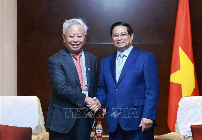 El primer ministro de Vietnam, Pham Minh Chinh, y Jin Liqun, presidente del Banco Asiático de Inversión en Infraestructura (AIIB). (Foto: VNA) El primer ministro de Vietnam, Pham Minh Chinh, y Jin Liqun, presidente del Banco Asiático de Inversión en Infraestructura (AIIB). (Foto: VNA)