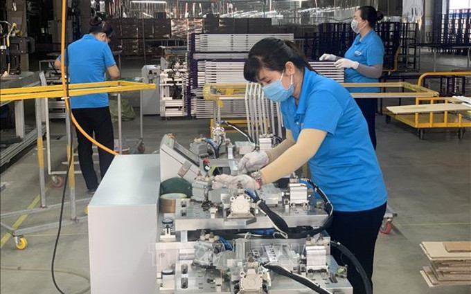 Trabajadores de una empresa surcoreana en Ba Ria-Vung Tau. (Fotografía: VNA)
