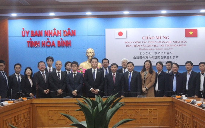 Asistentes a la reunión. (Fotografía: baohoabinh.com.vn)