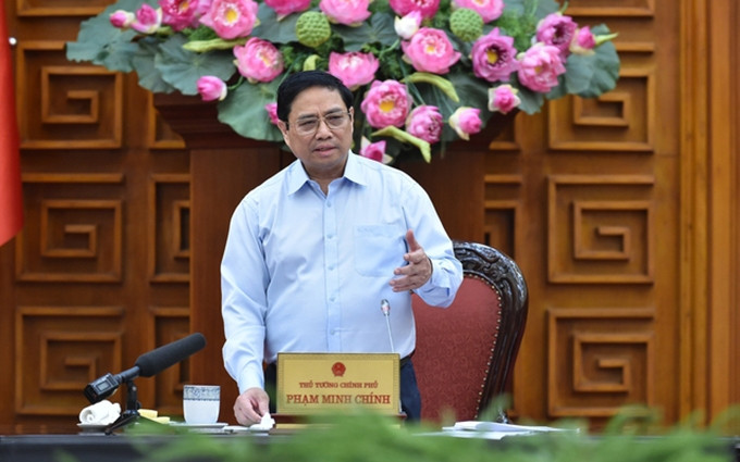 El primer ministro de Vietnam, Pham Minh Chinh, interviene en la reunión. (Fotografía: VGP)