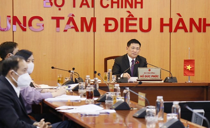 El ministro de Finanzas de Vietnam, Ho Duc Phoc, en la reunión. (Fotografía: tapchitaichinh.vn)