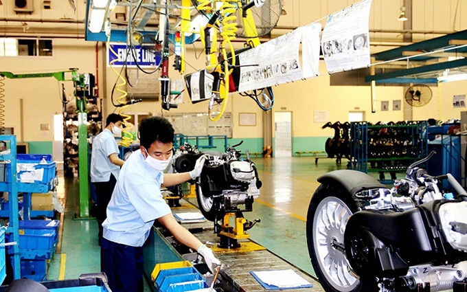 Montaje de motos en la empresa Piaggio en el Parque Industrial de Binh Xuyen, provincia de Vinh Phuc. (Fotografía: Nhan Dan/Ha Hong Ha)