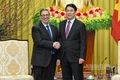 El presidente de Vietnam, Luong Cuong (derecha), y el enviado especial del Partido Comunista y del Estado cubano, Bruno Rodríguez Parrilla. (Foto: Nhan Dan)