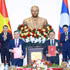 El primer ministro vietnamita, Le Minh Hung, y su homólogo laosiano, Saleumxay Kommasith, presencian la firma del acuerdo de cooperación entre ambos gobiernos en el sector financiero. (Foto: VNA)