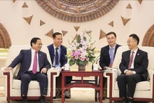 El primer ministro de Vietnam, Pham Minh Chinh, se reúne con Liu Ning, miembro del Comité Central del Partido Comunista de China y secretario de su Comité partidista en la Región Autónoma Zhuang de Guangxi. (Fuente: VNA)