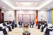 El primer ministro Pham Minh Chinh recibe a dirigentes de empresas chinas. (Fuente: VNA)