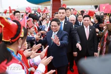Acto de bienvenida al primer ministro Pham Minh Chinh. (Foto: VNA)