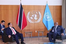 El primer ministro de Vietnam, Pham Minh Chinh, y el presidente del 78º período de sesiones de la Asamblea General de la ONU, Dennis Francis. (Foto: VNA)