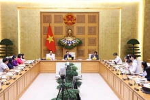 El viceprimer ministro de Vietnam Vu Duc Dam asiste al evento. (Fotografía: VNA)