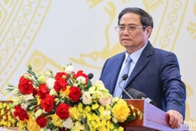 El primer ministro Pham Minh Chinh en la teleconferencia. (Fotografía: Nhan Dan)