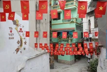 Un pequeño callejón de la calle Yen Phu está decorado con numerosas banderas vietnamitas. (Foto: VNA)