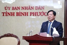 El vicepresidente del Comité Popular de Binh Phuoc, Tran Van Mi, interviene en el evento. (Fotografía: VNA)