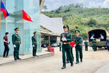 Ceremonia de repatriación de restos de combatientes voluntarios y expertos vietnamitas caídos en Laos, en la Puerta internacional de Cau Treo.