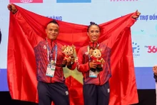 Los atletas Tran Hoang Duy Thuan y Bui Thi Thoa de Vietnam. (Foto: VNA)