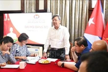 El embajador Le Quang Long habla en la cita. (Foto: VNA)