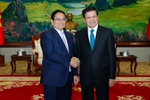 El primer ministro de Vietnam, Pham Minh Chinh (izquierda), se reúne con el secretario general del Partido Popular Revolucionario y presidente de Laos, Thongloun Sisoulith. (Foto: Nhan Dan)