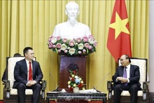 El presidente vietnamita, Nguyen Xuan Phuc.y el fiscal general de Rusia, Igor Krasnov. (Fotografía:VNA)
