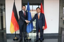 El ministro de Justicia de Vietnam, Le Thanh Long, y su homólogo germano, Marco Buschmann (Fotografía: VNA)