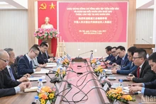 [Foto] Presidente-editor del periódico Nhan Dan recibe a la delegación del Diario del Pueblo (China)