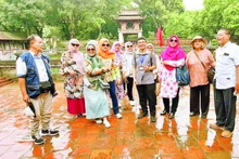 Turistas musulmanes visitan Hanói. (Foto: Nhan Dan)