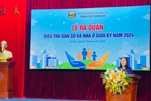La directora de la OGE, Nguyen Thi Huong, habla en la cita.
