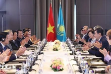 Durante la reunión entre To Lam y Yerlan Koshanov. (Foto: VNA)