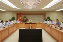 El viceprimer ministro de Vietnam, Tran Hong Ha, preside una reunión sobre el proyecto de establecimiento de un mercado de carbono. (Foto: VNA)