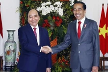 El presidente vietnamita, Nguyen Xuan Phuc, y su homólogo indonesio, Joko Widodo, (Fotografía: VNA)