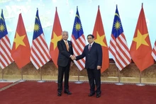 El primer ministro vietnamita, Pham Minh Chinh, y su homólogo de Malasia, Dato' Sri Ismail Sabri Yaacob (Foto: doanhnhanphaply.vn)