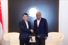 El ministro de Seguridad Pública de Vietnam, general Luong Tam Quang (izquierda) y el ministro del Interior de Singapur, K. Shanmugam (Foto: VNA)