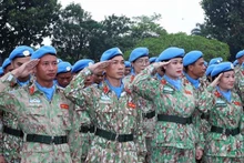 Miembros de equipos militares vietnamitas en el evento. (Foto:VNA)