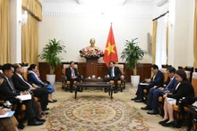 Durante la reunión. (Fotografía: qdnd.vn)