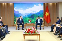 El primer ministro de Vietnam, Pham Minh Chinh, y Kudryashov Sergei Ivanovich, director general del grupo petrolero ruso Zarubezhneft. (Fotografía: VNA)