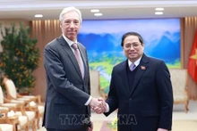 El primer ministro vietnamita, Pham Minh Chinh, y el canciller portugués, Joao Gomes Cravinho (Fotografía: VNA)