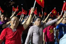 Vietnamitas en el extranjero celebran la reunificación nacional. (Foto: VNA)